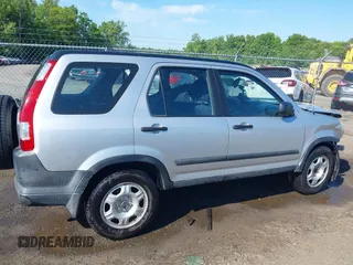 2006 Honda CR-V LX z VIN SHSRD78596U445523, wystawiony jako IAAI lot #42212230 z przebiegiem 141 228 mil mil oraz . Historia ofert i sprzedaży dostępna na DreamBid. Obrazek 14.