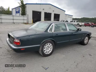 1999 Jaguar XJ with VIN SAJHX1044XC865054, listed as a Copart auction lot 57825325 with 71,145 mi miles and Clean title. Bid and sale history available at DreamBid. Image 3.