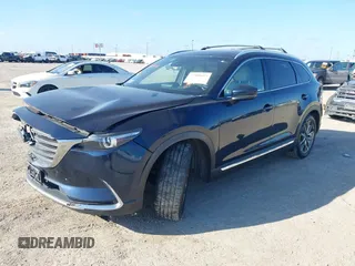 2016 Mazda CX-9 Grand Touring with VIN JM3TCADY6G0107064, listed as a IAAI auction lot 42580485 with 124,713 mi miles and . Bid and sale history available at DreamBid. Image 18.
