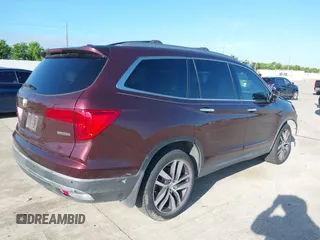 2017 Honda Pilot Touring with VIN 5FNYF5H96HB038413, listed as a IAAI auction lot 42594065 with 130,501 mi miles and . Bid and sale history available at DreamBid. Image 4.