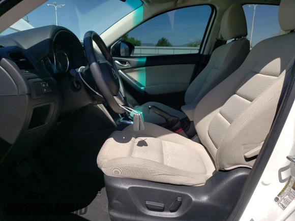 2014 Mazda CX-5 Touring z VIN JM3KE4CYXE0393443, wystawiony jako Copart lot #54738705 z przebiegiem 68 220 mil mil oraz Szkody całkowita. Historia ofert i sprzedaży dostępna na DreamBid. Obrazek 7.