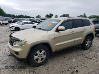 2011 Jeep Grand Cherokee Laredo z VIN 1J4RR4GG4BC671299, wystawiony jako Copart lot #63657375 z przebiegiem 195 214 mil mil oraz Czysty tytuł • Clean title. Historia ofert i sprzedaży dostępna na DreamBid. Obrazek 1.