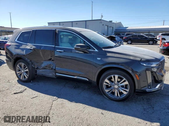 2022 Cadillac XT6 Premium Luxury with VIN 1GYKPCRS9NZ125022, listed as a Copart auction lot 42392485 with 34,703 mi miles and Salvage Title. Bid and sale history available at carsss.com. Image 4.