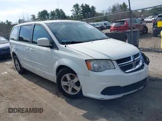 2012 Dodge Grand Caravan SXT with VIN 2C4RDGCGXCR358794, listed as a IAAI auction lot 42007316 with 212,518 mi miles and . Bid and sale history available at DreamBid. Image 1.