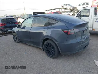 2023 Tesla Model Y Long Range with VIN 7SAYGDEE1PA053683, listed as a IAAI auction lot 42124517 with 32,295 mi miles. Bid and sale history available at carsss.com. Image 3.