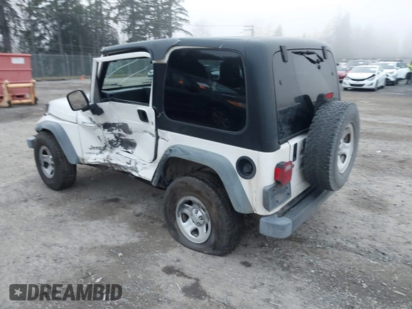2006 Jeep Wrangler Sport Right Hand Drive with VIN 1J4F449S16P709895, listed as a IAAI auction lot 41349311 with 157,125 mi miles. Bid and sale history available at carsss.com. Image 3.