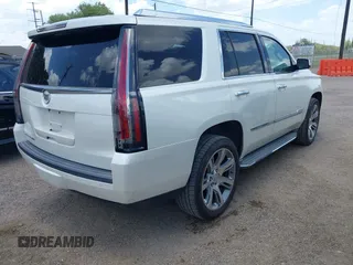 2015 Cadillac Escalade Luxury z VIN 1GYS4BKJ1FR215223, wystawiony jako IAAI lot #42548931 z przebiegiem 145 947 mil mil oraz . Historia ofert i sprzedaży dostępna na DreamBid. Obrazek 4.