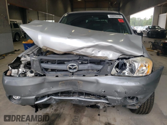 2001 Mazda Tribute LX with VIN 4F2CU08141KM65160, listed as a Copart auction lot 60895624 with 255,194 mi miles and Salvage Title. Bid and sale history available at DreamBid. Image 5.