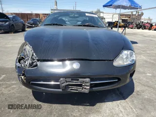 1997 Jaguar XK with VIN SAJGX5740VC014035, listed as a Copart auction lot 53066215 with 140,692 mi miles and Salvage Title. Bid and sale history available at DreamBid. Image 5.
