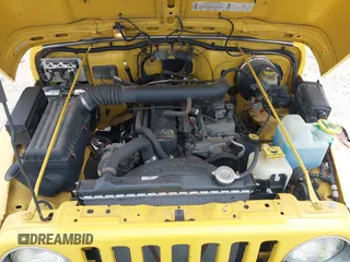 2000 Jeep Wrangler Sport with VIN 1J4FA49S2YP768451, listed as a IAAI auction lot 42136785 with 74,492 mi miles. Bid and sale history available at carsss.com. Image 10.