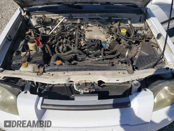 2002 Nissan Frontier SE z VIN 1N6ED27T42C319065, wystawiony jako Copart lot #74206474 z przebiegiem 147 724 mil mil oraz Szkoda całkowita • Salvage title. Historia ofert i sprzedaży dostępna na DreamBid. Obrazek 11.