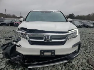 2020 Honda Pilot Touring 8-Passenger with VIN 5FNYF6H95LB053631, listed as a Copart auction lot 47732865 with 67,728 mi miles and Salvage Title. Bid and sale history available at DreamBid. Image 5.