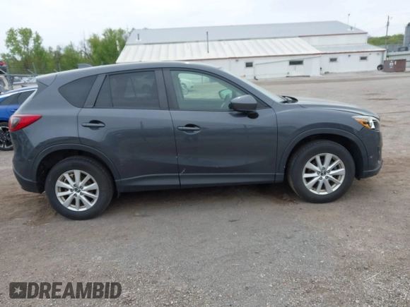 2014 Mazda CX-5 Touring with VIN JM3KE2CYXE0332517, listed as a IAAI auction lot 42109592 with 138,214 mi miles. Bid and sale history available at carsss.com. Image 13.