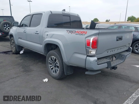 2021 Toyota Tacoma SR with VIN 3TMCZ5AN2MM405869, listed as a IAAI auction lot 42094533 with 78,449 mi miles and . Bid and sale history available at DreamBid. Image 3.