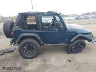 2003 Jeep Wrangler X with VIN 1J4FA39S23P300447, listed as a IAAI auction lot 41791733 with 165,576 mi miles. Bid and sale history available at carsss.com. Image 13.