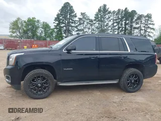 2015 GMC Yukon SLT with VIN 1GKS1BKC5FR274408, listed as a IAAI auction lot 41942157 with 165,978 mi miles. Bid and sale history available at carsss.com. Image 14.