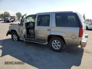 2000 Cadillac Escalade z VIN 1GYEK63R8YR228214, wystawiony jako Copart lot #73567434 z przebiegiem 235 399 mil mil oraz Szkody całkowita. Historia ofert i sprzedaży dostępna na DreamBid. Obrazek 2.