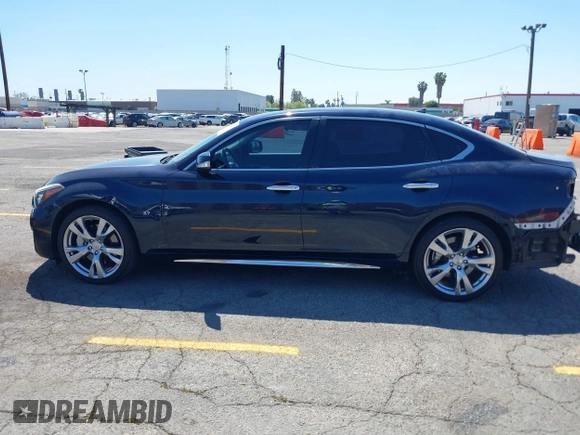 2015 Infiniti Q70 with VIN JN1BY1PP8FM601834, listed as a IAAI auction lot 42028330 with 106,285 mi miles and . Bid and sale history available at DreamBid. Image 14.