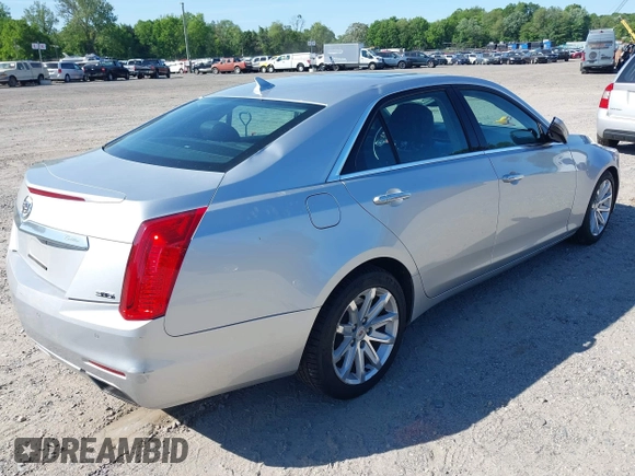 2014 Cadillac CTS Luxury AWD with VIN 1G6AX5S34E0124464, listed as a IAAI auction lot 42298607 with 89,351 mi miles and . Bid and sale history available at DreamBid. Image 4.