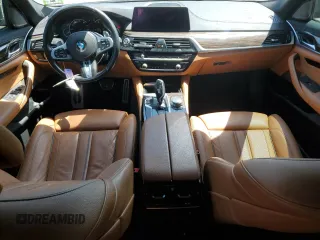 2018 BMW 5 Series M550i xDrive with VIN WBAJB9C56JB286479, listed as a Copart auction lot 57108645 with 71,782 mi miles and Salvage title. Bid and sale history available at DreamBid. Image 8.