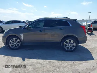 2015 Cadillac SRX Performance Collection with VIN 3GYFNCE31FS598109, listed as a IAAI auction lot 41788267 with 172,488 mi miles and . Bid and sale history available at DreamBid. Image 14.