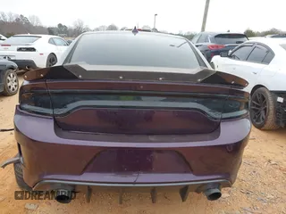 2021 Dodge Charger Scat Pack Widebody with VIN 2C3CDXGJ5MH579324, listed as a IAAI auction lot 41399676 with 77,156 mi miles and . Bid and sale history available at DreamBid. Image 16.