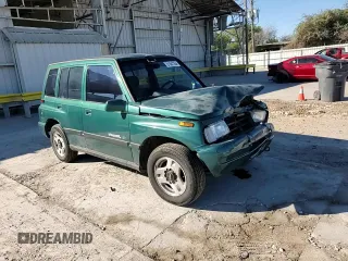 1996 Geo Tracker z VIN 2CNBE1363T6921541, wystawiony jako Copart lot #81647384 z przebiegiem 61 806 mil mil oraz Szkoda całkowita • Salvage title. Historia ofert i sprzedaży dostępna na DreamBid. Obrazek 12.