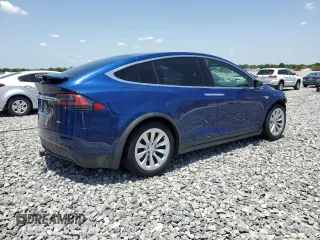 2016 Tesla Model X 70D z VIN 5YJXCAE29GF001522, wystawiony jako Copart lot #56571115 z przebiegiem 129 924 mil mil oraz Szkody całkowita. Historia ofert i sprzedaży dostępna na DreamBid. Obrazek 3.