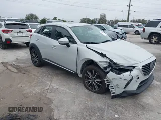 2016 Mazda CX-3 Grand Touring with VIN JM1DKDD72G0128891, listed as a IAAI auction lot 41401456 with 60,911 mi miles. Bid and sale history available at carsss.com. Image 1.