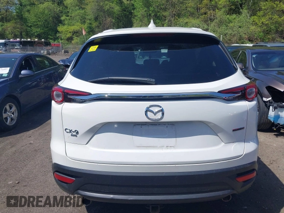 2021 Mazda CX-9 Touring z VIN JM3TCBCYXM0521323, wystawiony jako IAAI lot #42190976 z przebiegiem 56 652 mil mil oraz . Historia ofert i sprzedaży dostępna na DreamBid. Obrazek 16.