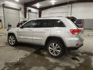 2011 Jeep Grand Cherokee 70th Anniversary with VIN 1J4RR4GG0BC666357, listed as a Copart auction lot 71726674 with 122,802 mi miles and Salvage Title. Bid and sale history available at carsss.com. Image 2.