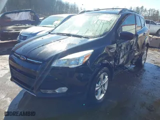 2013 Ford Escape SE with VIN 1FMCU9GX4DUD30453, listed as a IAAI auction lot 41589446 with 130,556 mi miles. Bid and sale history available at carsss.com. Image 2.