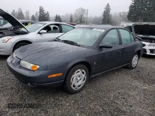 2000 Saturn SL z VIN 1G8ZK5270YZ269898, wystawiony jako Copart lot #88082365 z przebiegiem 124 233 mil mil oraz Szkoda całkowita • Salvage title. Historia ofert i sprzedaży dostępna na DreamBid. Obrazek 1.