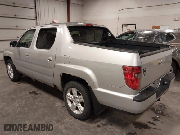 2009 Honda Ridgeline RTL with VIN 2HJYK16519H000129, listed as a IAAI auction lot 41891810 with 186,124 mi miles. Bid and sale history available at carsss.com. Image 3.