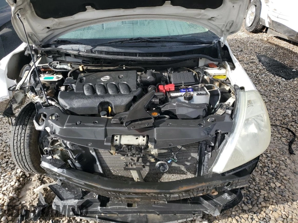 2009 Nissan Versa S z VIN 3N1BC13E89L383363, wystawiony jako Copart lot #72003164 z przebiegiem 104 953 mil mil oraz Szkoda całkowita • Salvage title. Historia ofert i sprzedaży dostępna na DreamBid. Obrazek 11.