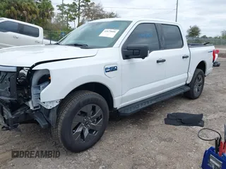 2024 Ford F-150 Lightning XLT with VIN 1FTVW3LKXRWG01185, listed as a IAAI auction lot 41679606 with 4,961 mi miles and . Bid and sale history available at DreamBid. Image 18.
