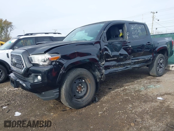 2018 Toyota Tacoma SR5 with VIN 3TMAZ5CN6JM055632, listed as a IAAI auction lot 40751593 with 125,663 mi miles and . Bid and sale history available at DreamBid. Image 18.