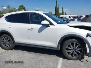 2018 Mazda CX-5 Grand Touring with VIN JM3KFADM8J0373368, listed as a IAAI auction lot 42013535 with 63,142 mi miles and . Bid and sale history available at DreamBid. Image 13.