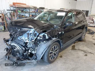 2021 Volkswagen Tiguan S with VIN 3VV0B7AX8MM020189, listed as a IAAI auction lot 42615767 with 70,294 mi miles and . Bid and sale history available at DreamBid. Image 2.