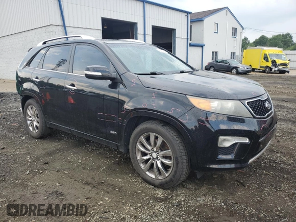 2012 Kia Sorento SX with VIN 5XYKWDA2XCG306782, listed as a Copart auction lot 65626604 with 137,060 mi miles and Salvage Title. Bid and sale history available at carsss.com. Image 4.