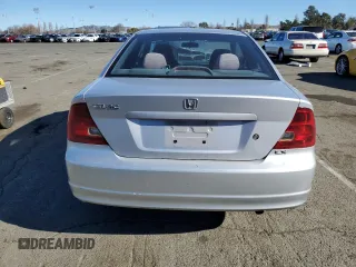 2003 Honda Civic LX with VIN 1HGEM21563L065861, listed as a Copart auction lot 41876845 with 233,101 mi miles and Salvage Title. Bid and sale history available at DreamBid. Image 6.