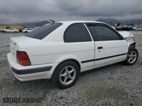 1996 Toyota Tercel DX z VIN JT2AC52L5T0145290, wystawiony jako Copart lot #45027855 z przebiegiem 186 673 mil mil oraz Szkoda całkowita • Salvage title. Historia ofert i sprzedaży dostępna na DreamBid. Obrazek 3.