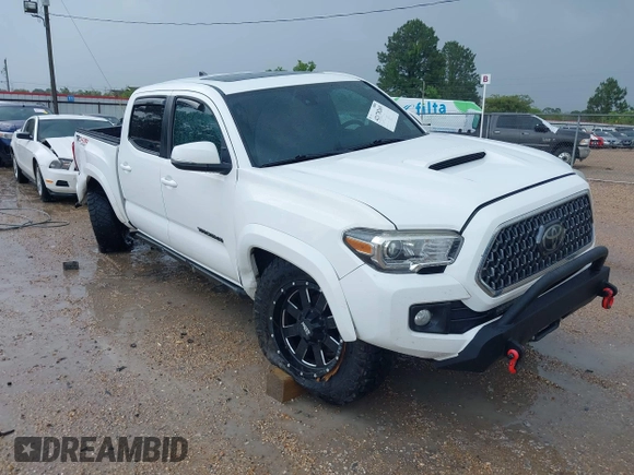 2019 Toyota Tacoma SR z VIN 3TMCZ5AN0KM232852, wystawiony jako IAAI lot #42178269 z przebiegiem 71 545 mil mil oraz . Historia ofert i sprzedaży dostępna na DreamBid. Obrazek 1.
