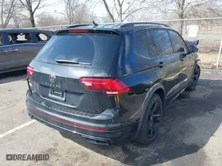 2023 Volkswagen Tiguan SE R-Line Black with VIN 3VVCB7AXXPM094621, listed as a IAAI auction lot 41737103 with 21,069 mi miles. Bid and sale history available at carsss.com. Image 4.