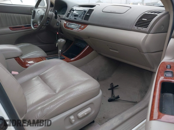 2004 Toyota Camry LE with VIN 4T1BF30K74U073676, listed as a IAAI auction lot 41668460 with 249,847 mi miles. Bid and sale history available at carsss.com. Image 5.