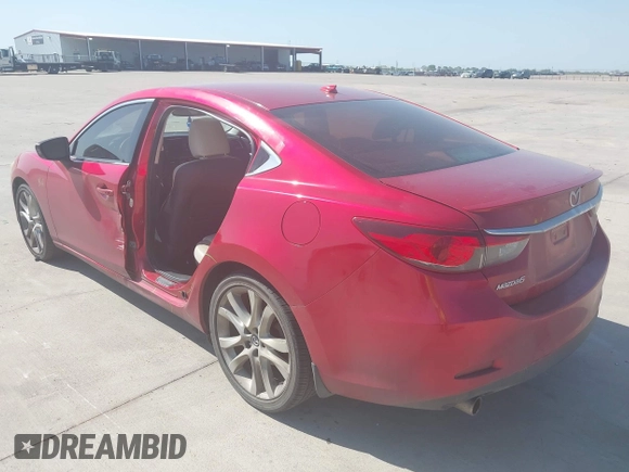 2014 Mazda 6 i Grand Touring with VIN JM1GJ1W65E1141953, listed as a IAAI auction lot 42027145 with 187,514 mi miles and . Bid and sale history available at DreamBid. Image 3.