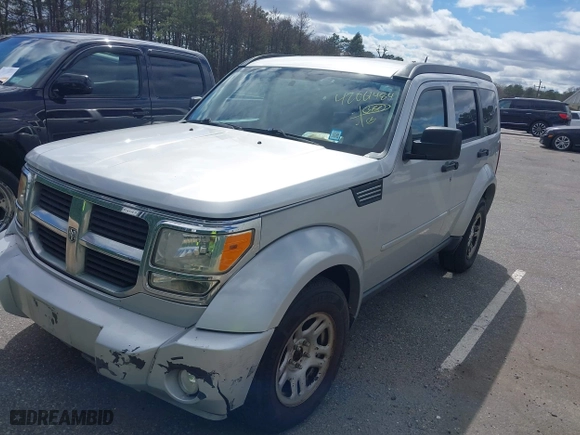 2011 Dodge Nitro SE with VIN 1D4PU2GKXBW508467, listed as a IAAI auction lot 42061484 with 100,295 mi miles. Bid and sale history available at carsss.com. Image 2.