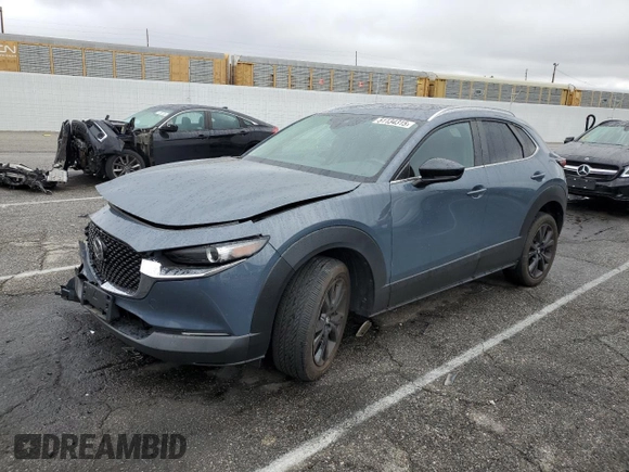 2023 Mazda CX-30 2.5 S Carbon Edition with VIN 3MVDMBCMXPM542809, listed as a Copart auction lot 51134315 with 21,279 mi miles and Salvage Title. Bid and sale history available at carsss.com. Image 1.