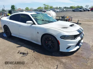 2016 Dodge Charger SRT Hellcat z VIN 2C3CDXL91GH338831, wystawiony jako IAAI lot #42104173 z przebiegiem Nie podano mil oraz . Historia ofert i sprzedaży dostępna na DreamBid. Obrazek 1.