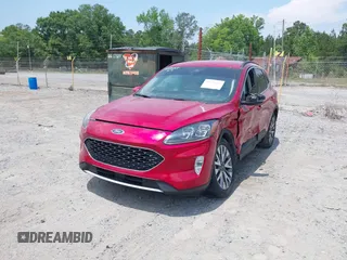 2020 Ford Escape Titanium z VIN 1FMCU9J92LUA39457, wystawiony jako IAAI lot #42222441 z przebiegiem 107 148 mil mil oraz . Historia ofert i sprzedaży dostępna na DreamBid. Obrazek 2.